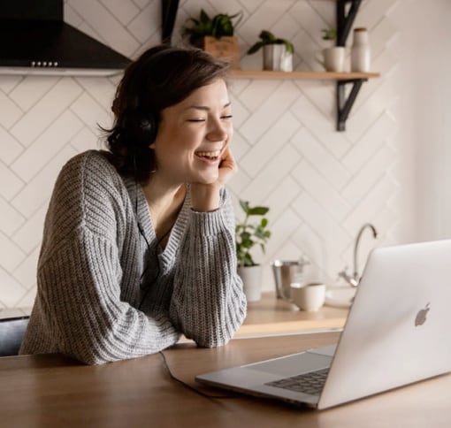 women in videocall on laptop